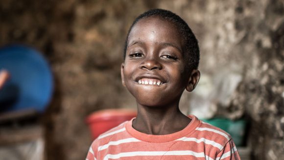 From the cover of Sightsavers' 2016 annual report: Fahad, aged 6, at his home in Zanzibar days after a successful operation to remove bilateral congenital cataracts.