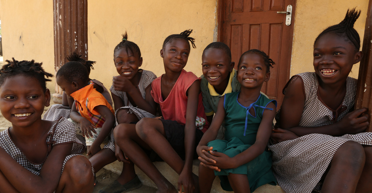 A group of children smiling