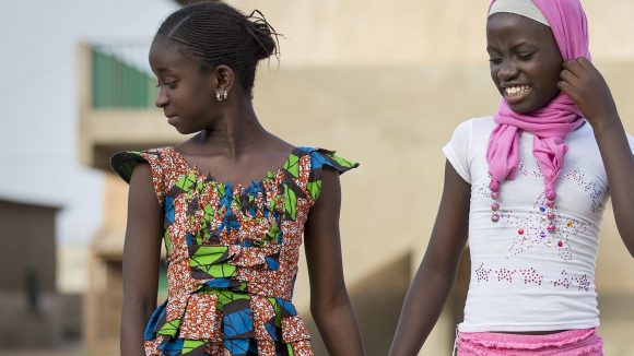 Two girls walking next to each other