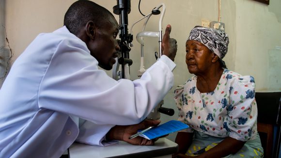 Madalitzo Nyangulu examining a lady's eye.