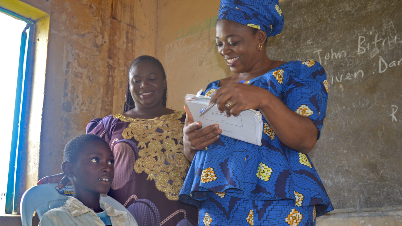 Rakiya speaks to one of her students before the eye test.