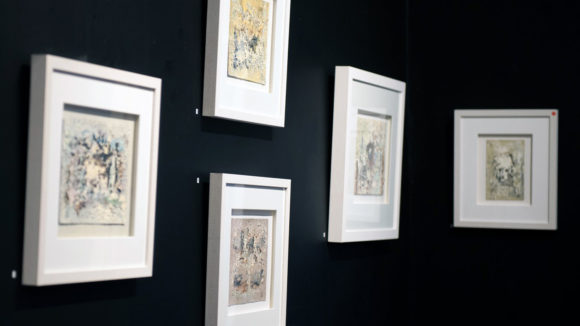 Five paintings in frames from the exhibition.