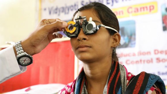 Indian girl at a school eye test