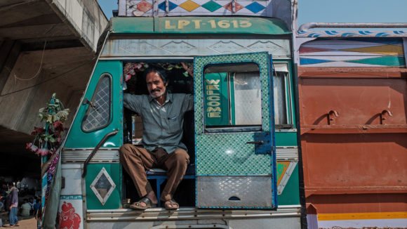 A man sits in his truck.