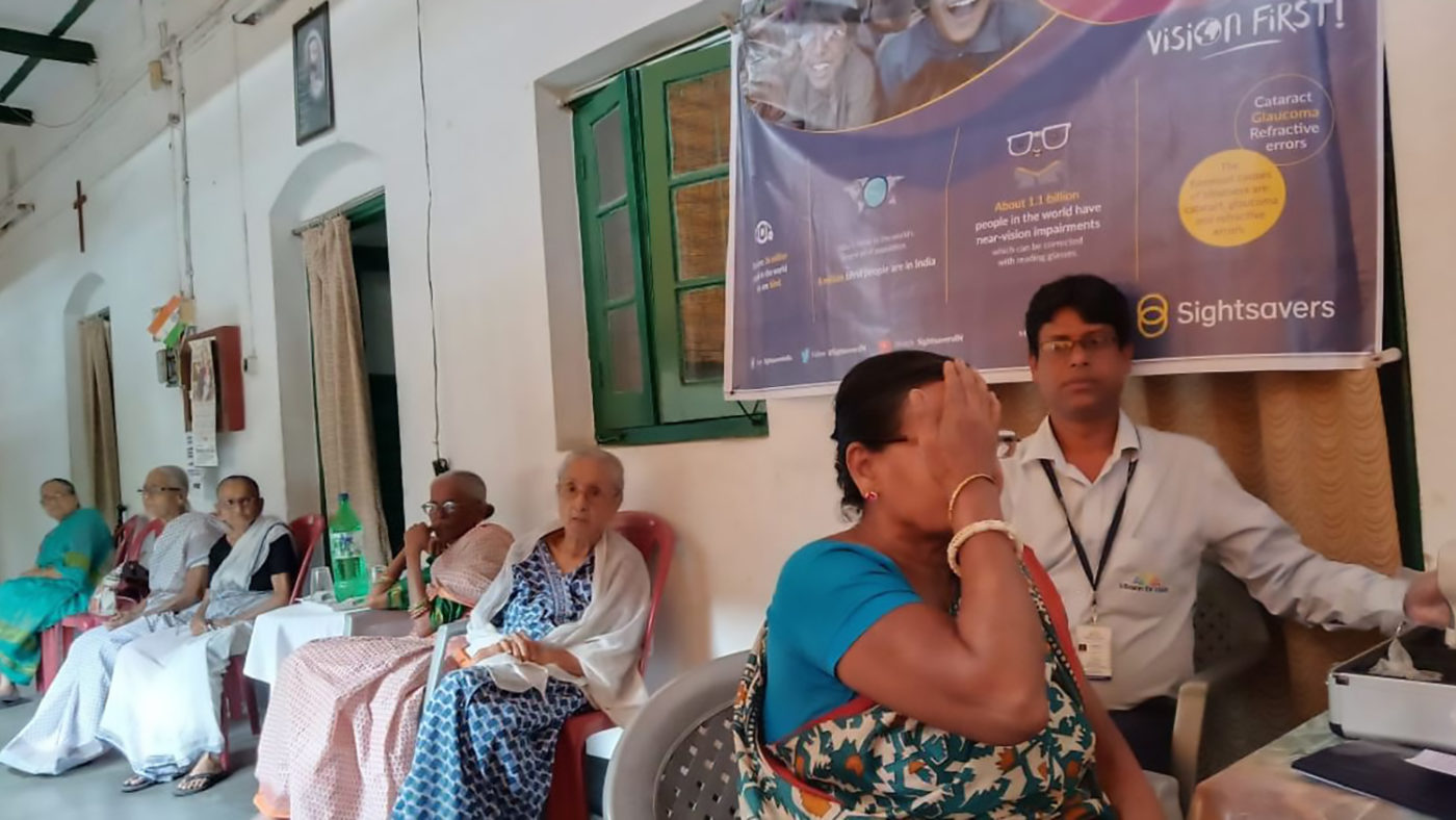 An older women has her eye sight tested.