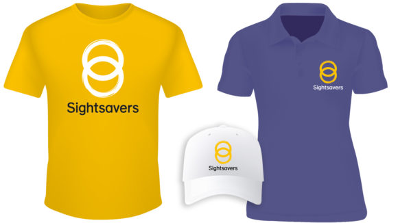 Examples of Sightsavers-branded clothing: a yellow t-shirt, a lilac polo shirt and a white baseball cap.