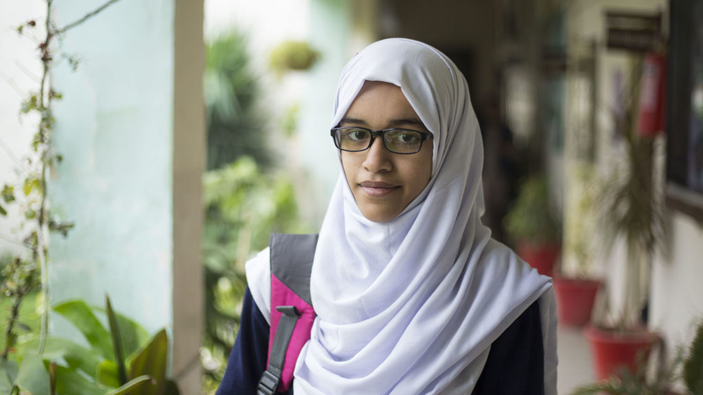 A girl wearing glasses.