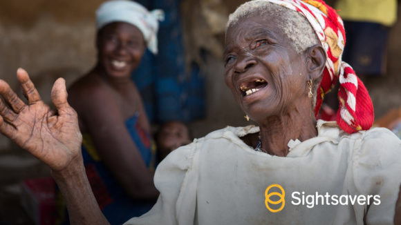 An example of a social media image in portrait orientation, showing a woman smiling and a Sightsavers logo.