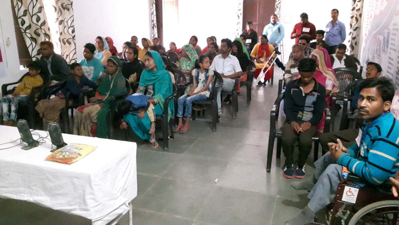 A large group of people at a meeting.
