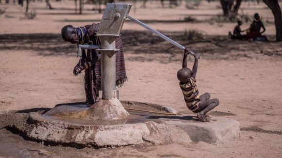 Hand washing at a water pump in rural Kenya