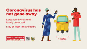 A poster that says 'COVID has not gone away' and showcasing one-meter social distancing.