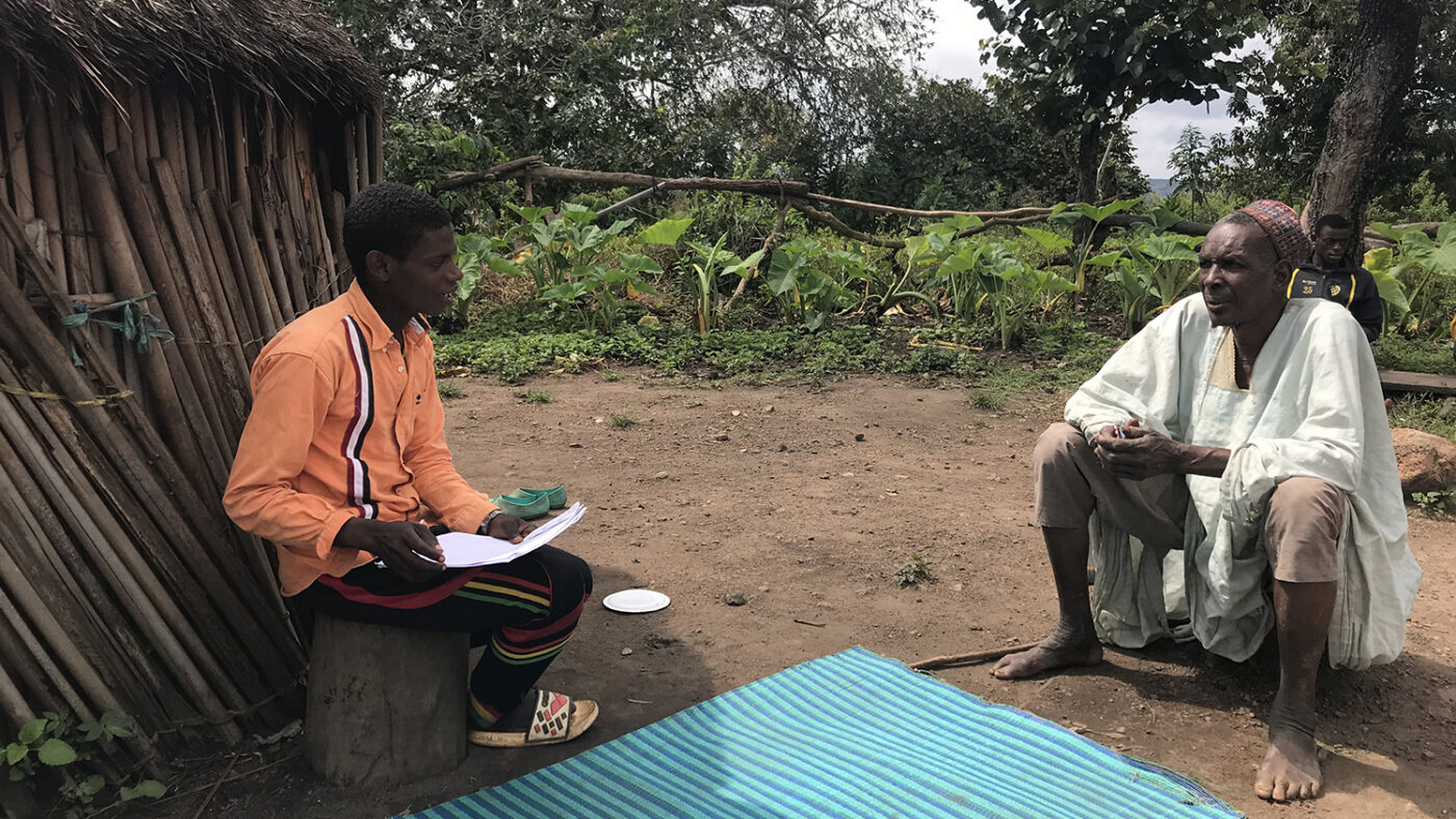 A community volunteer obtains consent to conduct a screening.