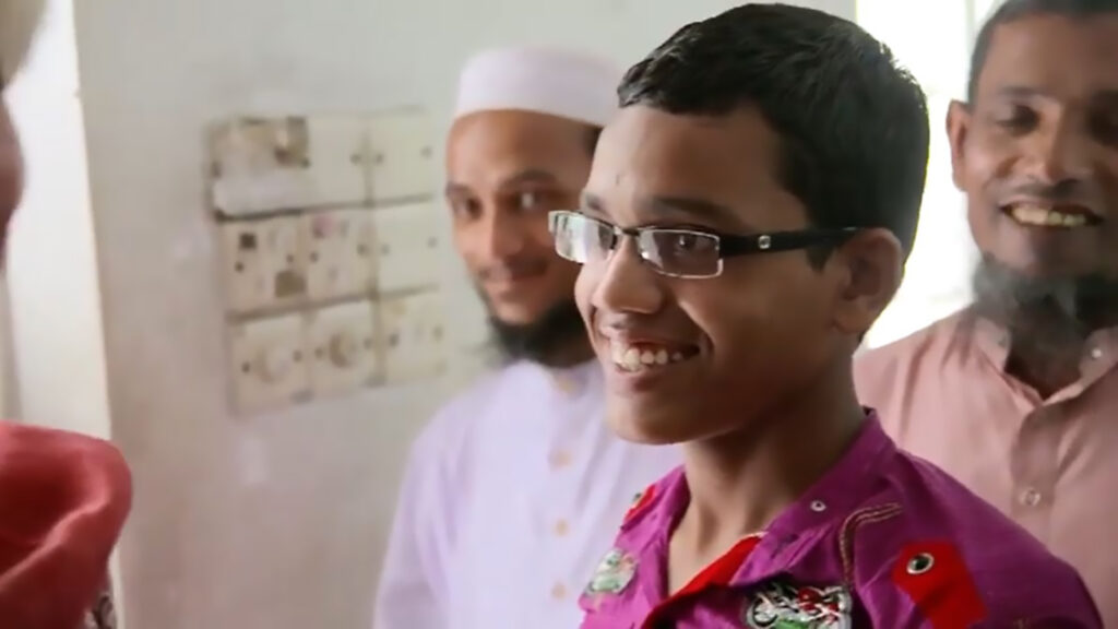A A teenage boy smiling.
