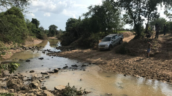 Truck crossing a flooded road