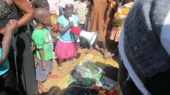 A woman holding a megaphone.