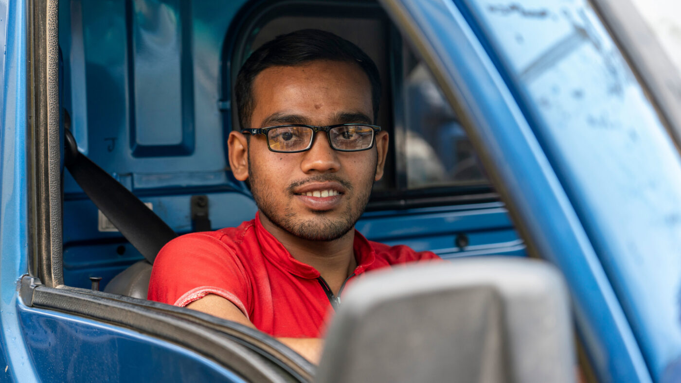 Arif, who was treated for cataract by Sightsavers when he was a child, is now an adult who can drive a lorry.