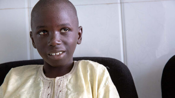 Souleymane smiling the day after his cataract surgery