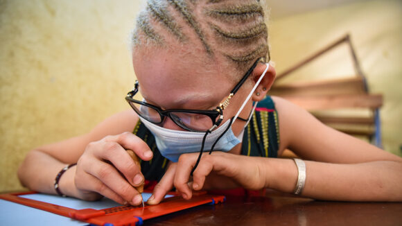 Noutene, who is visually impaired, at school during the pandemic.