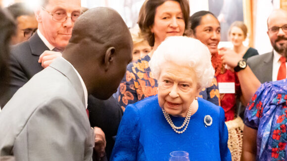 Trachoma surgeon Samson Lokele meets the Queen at a reception at Buckingham Palace.