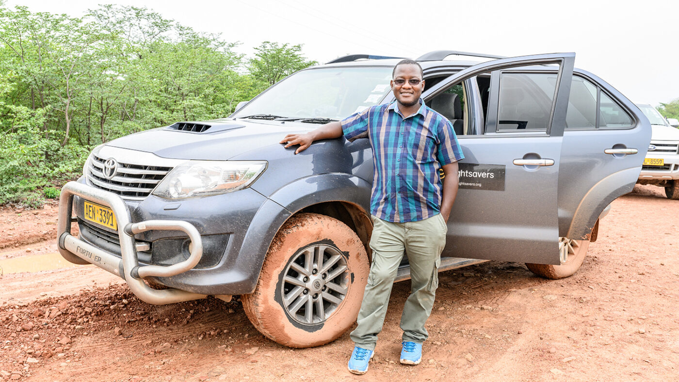 Sightsavers Zimbabwe country director Peter Bare stands next to his vehicle in the Binga district
