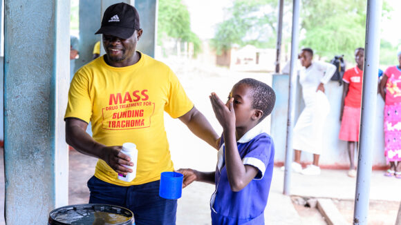 Ndumiso Ndlovu, an Ophthalmic nurse, provides trachoma treatment as part of mass drug administration in Zimbabwe.
