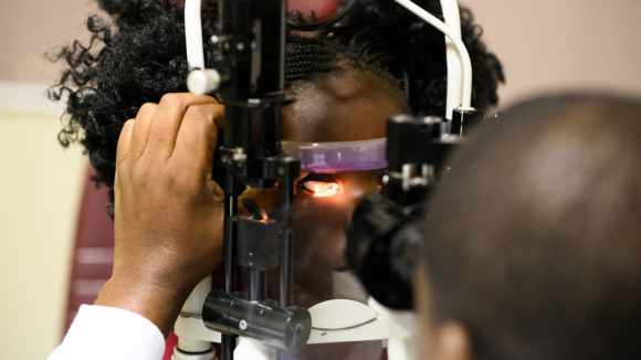 A young girl undergoes an eye examination.