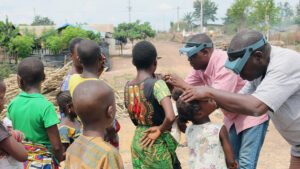Eye care staff perform trachoma surveys on children in Cote D'Ivoire.