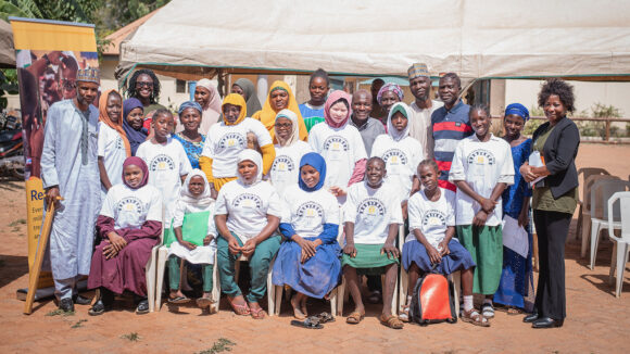 Teenage girls learning trade skills in Nigeria pose for a group photo along with course leaders.