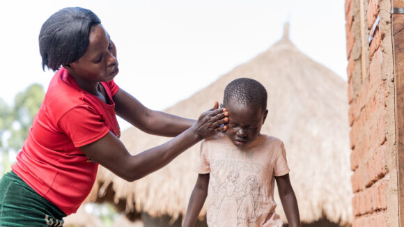 Fosca attempts to wash Happy's eyes with soap and water.