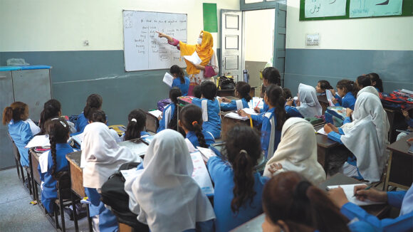 A photograph of a school classroom in Pakistan.