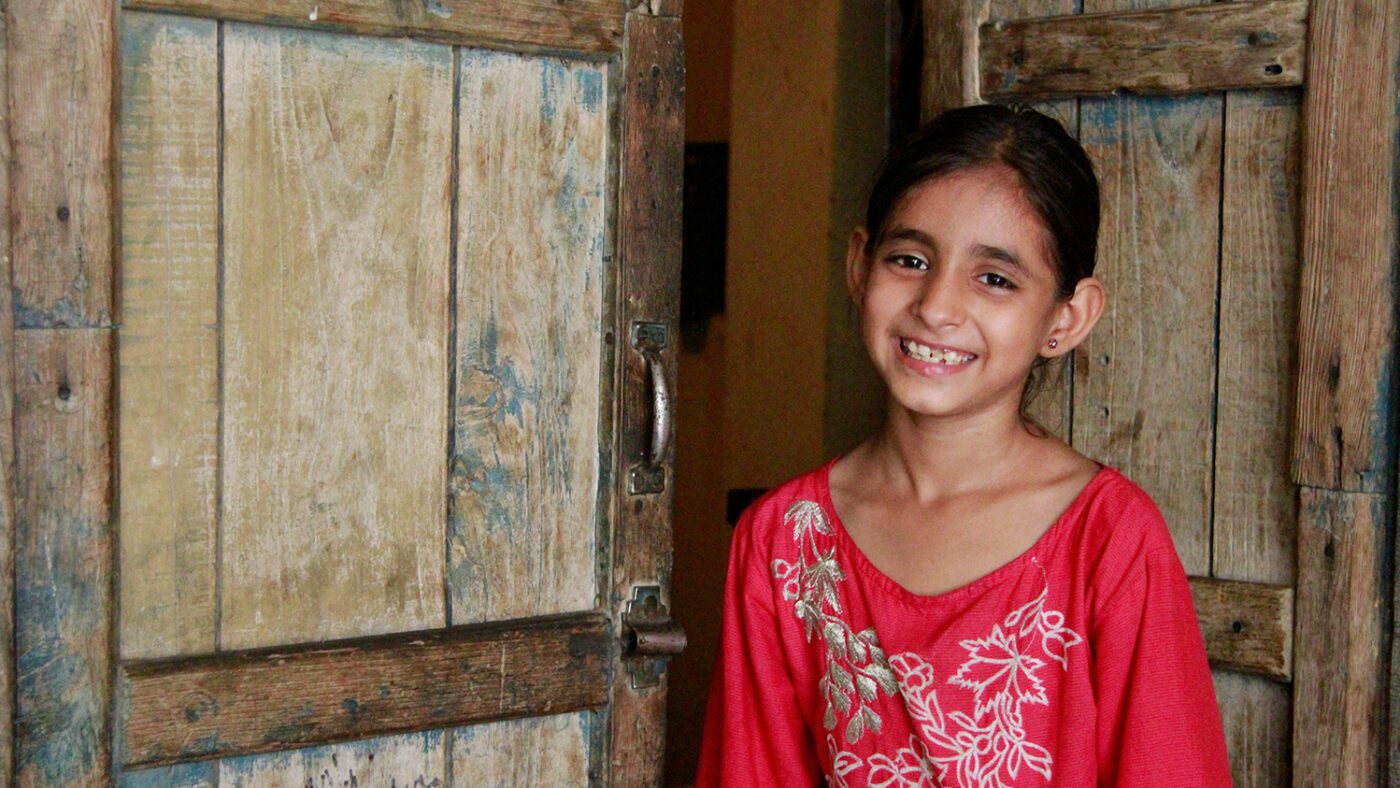 Nayab, a nine-year-old girl, smiling after her successful cataract operation.