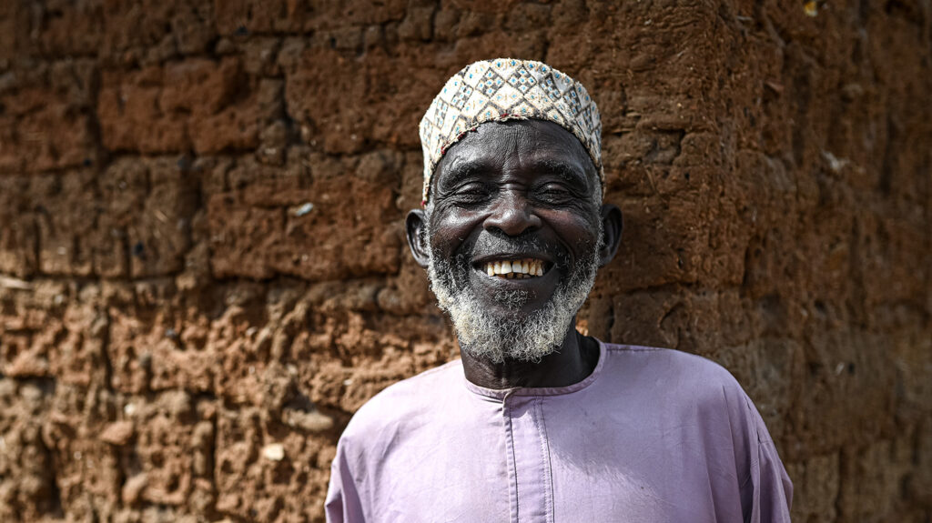 Ado smiles after receiving medication to protect him from river blindness.
