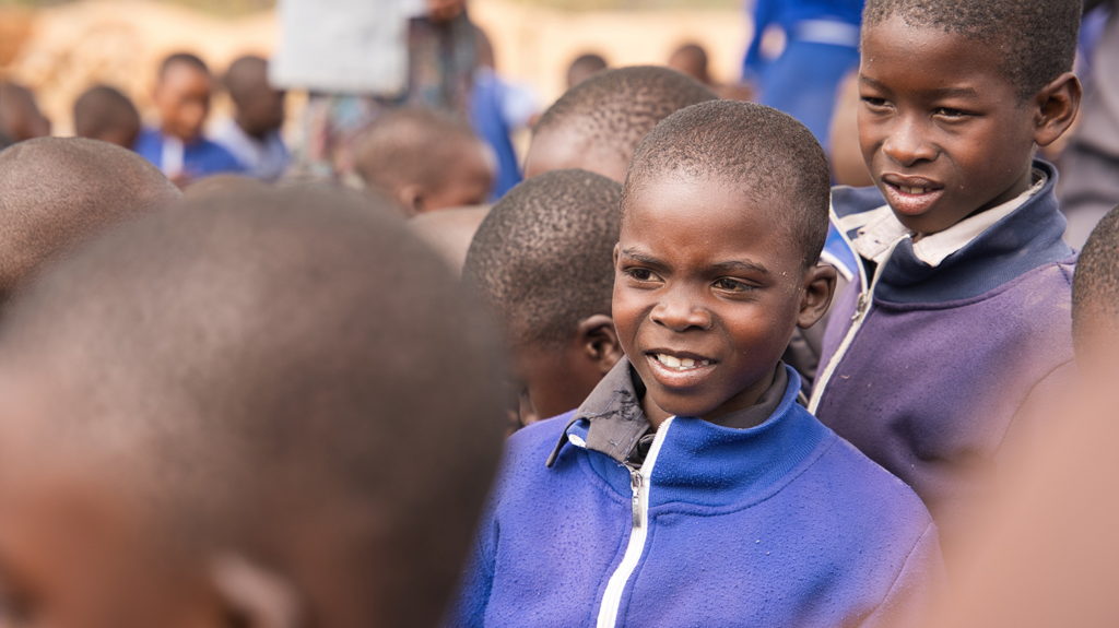 Ariel, who had trachoma, stands outside with his friends at school.