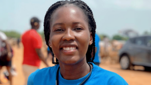 A woman smiles at the camera.